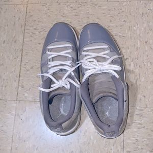 These are some men Jordan 11 low. Size 10.5  grey and white in color.